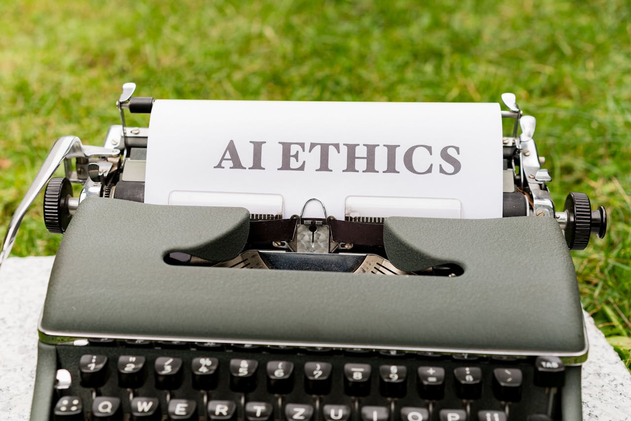heros-img A vintage typewriter outdoors displaying "AI ethics" on paper, symbolizing tradition meets technology.